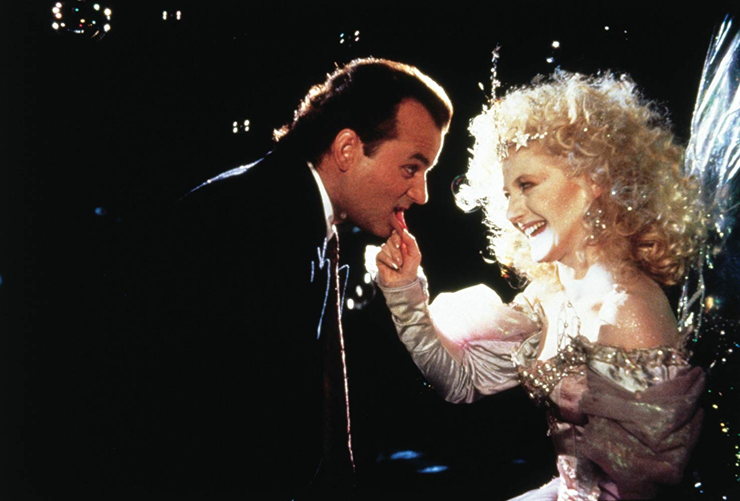 Bill Murray meets the Ghost of Christmas Present (Carol Kane) in Scrooged (1988)