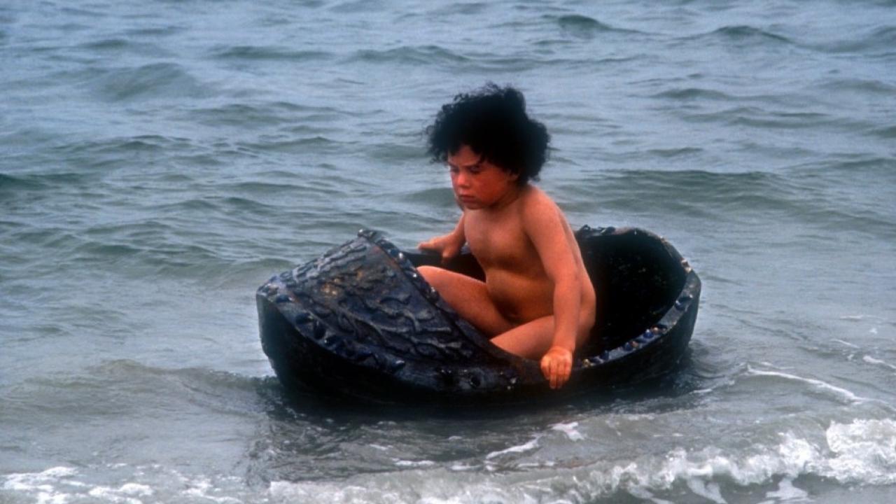 Young Jamie (Cillian Byrne) afloat in his crib in The Secret of Roan Inish (1994)