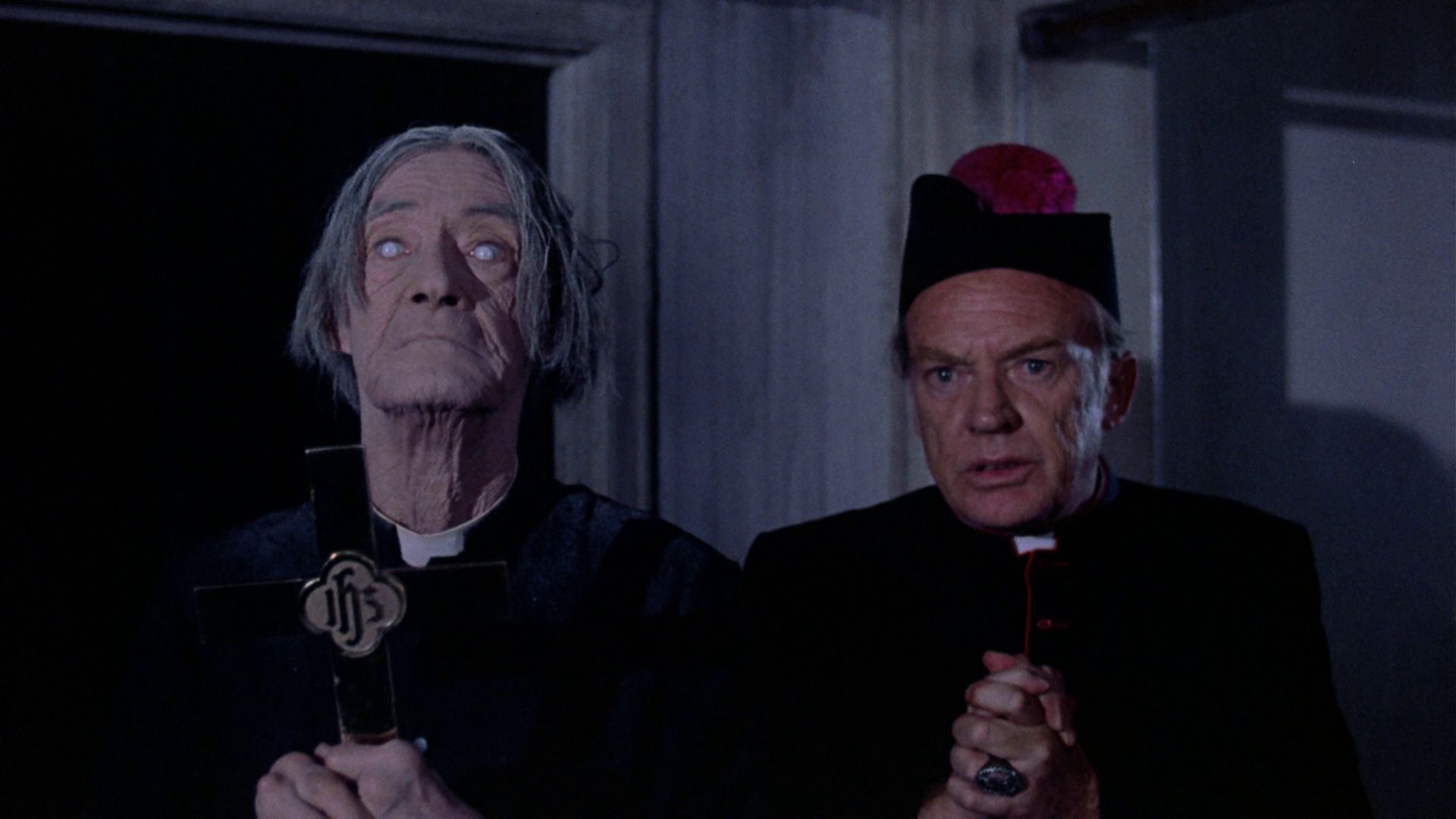 (l to r) John Carradine as Father Halliran, the blind priest on the top floor, and Arthur Kennedy as Monsignor Franchino in The Sentinel (1977)