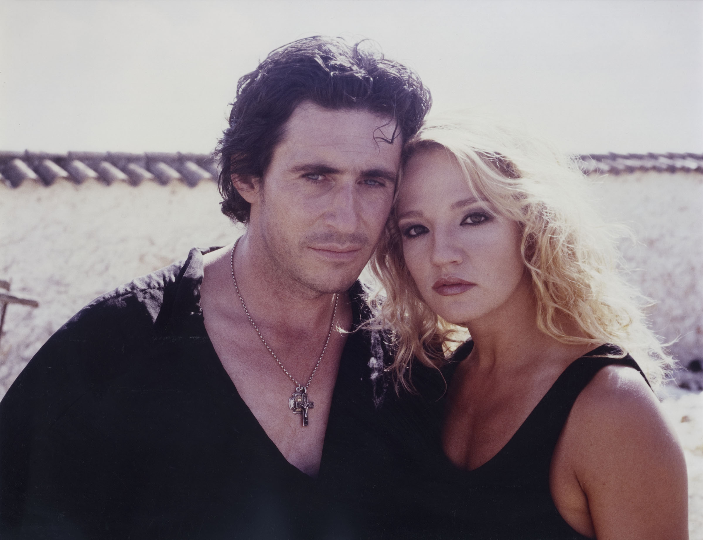 Ellen Barkin as Claire, a stunwoman passing through a series of strange adventures, and her Spanish lover Gabriel Byrne in Siesta (1987)