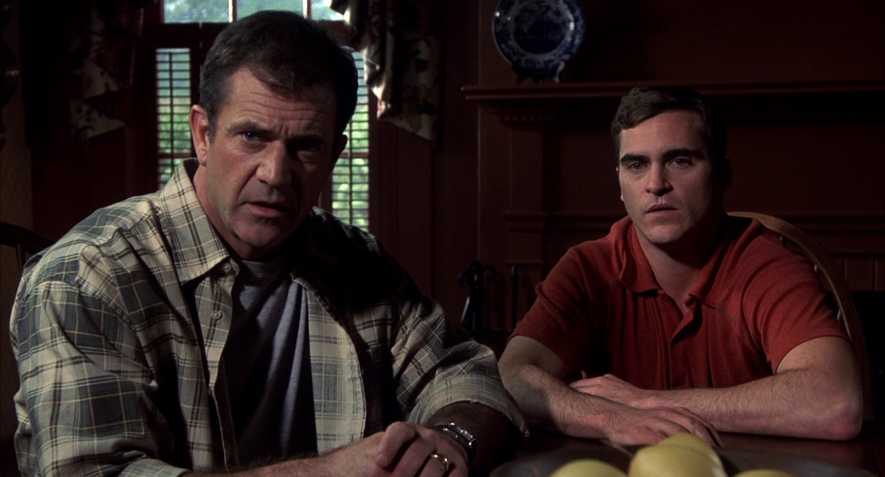 Mel Gibson and his brother Joaquin Phoenix in Signs (2002)