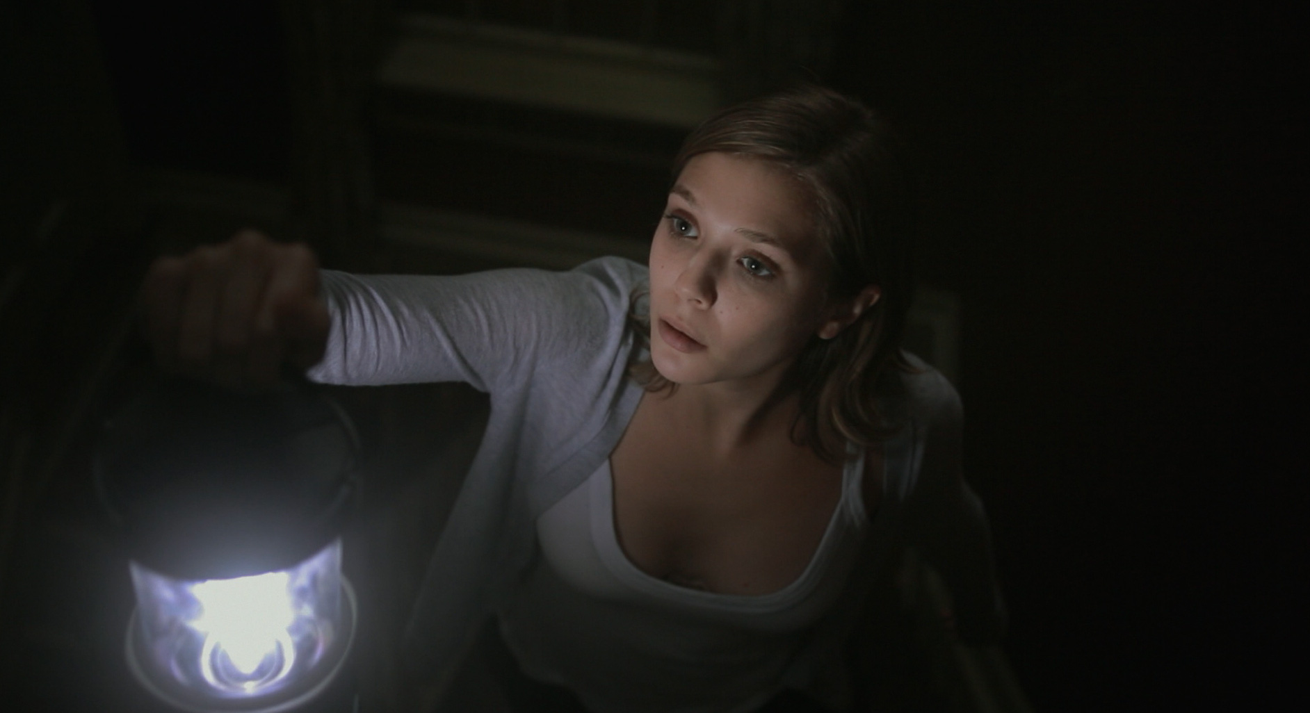 Elizabeth Olsen investigates the haunted house in Silent House (2011)