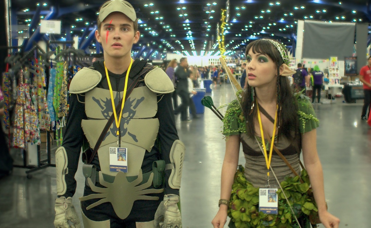Michael Johnston and Hannah Marks attend a convention in Slash (2016)
