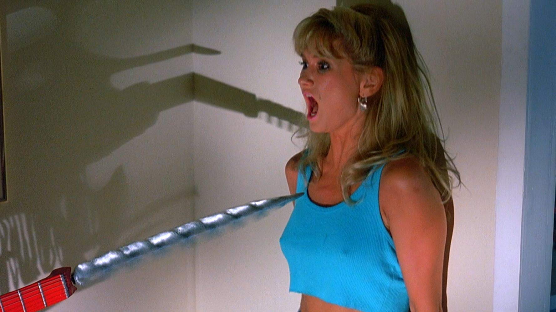 Heidi Kozak threatened by The Driller Killer in Slumber Party Massacre II (1987)