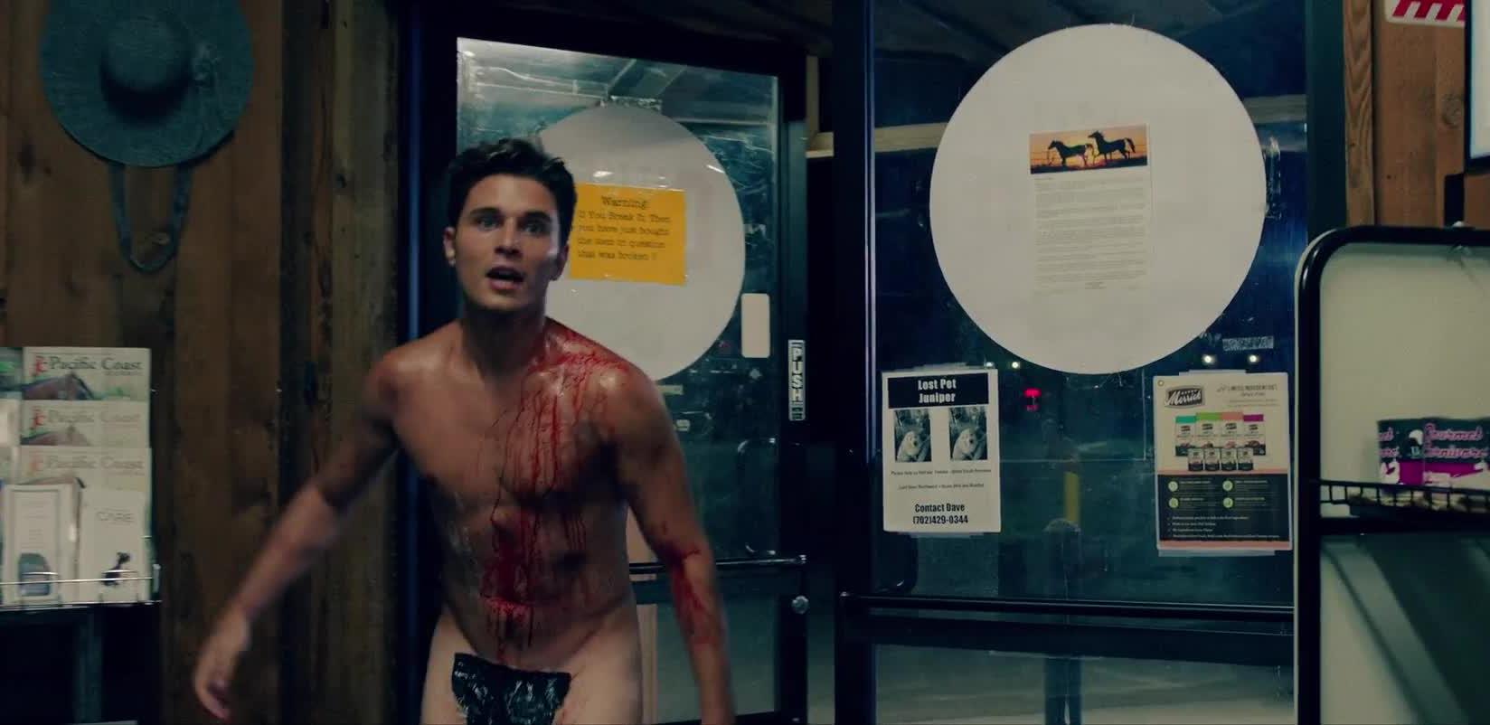 Ronen Rubinstein flees into a gas station pursed by the cultists in Smiley Face Killers (2020)
