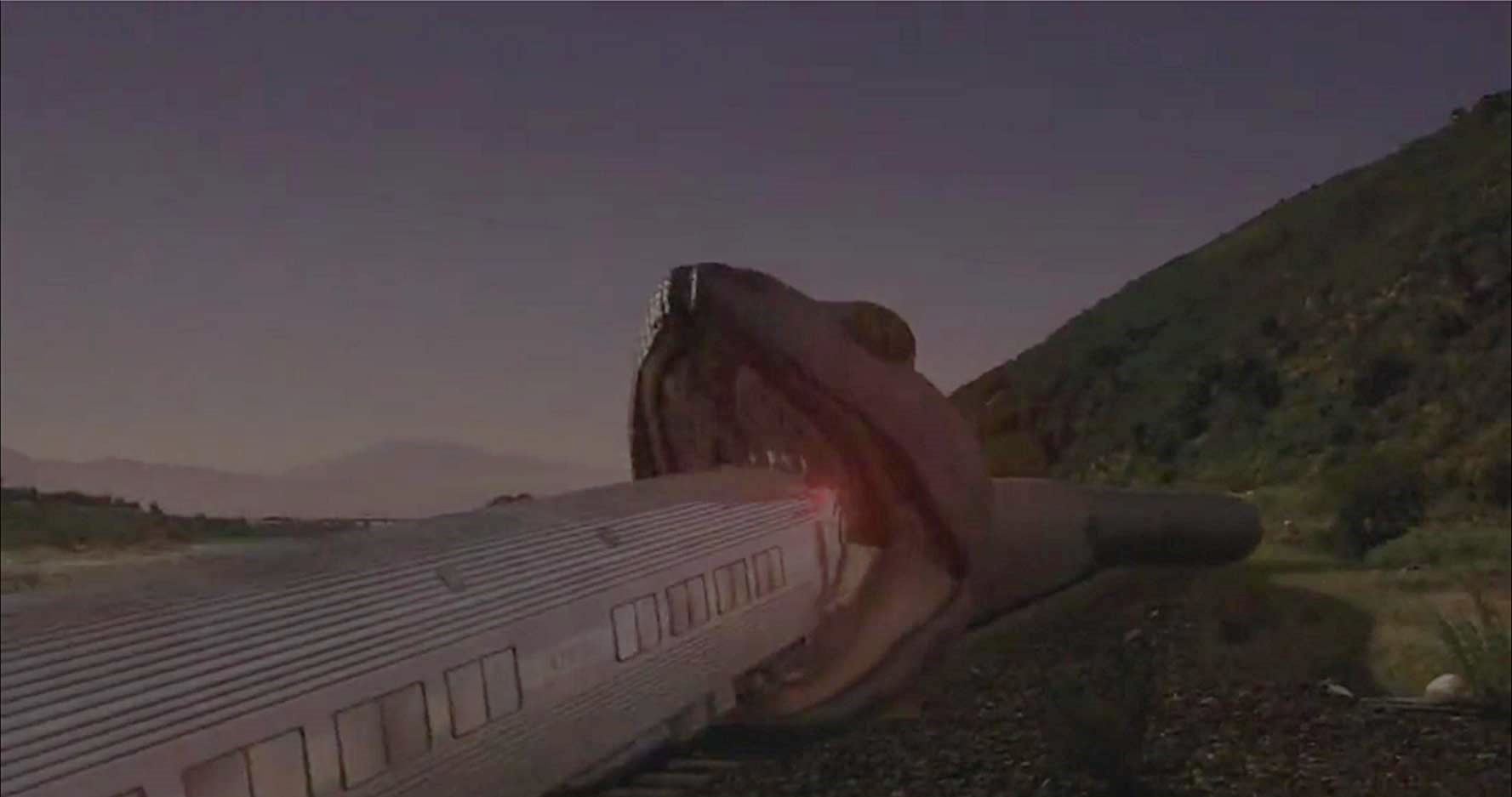 A giant snake tries to devour the train in Snakes on a Train (2006)