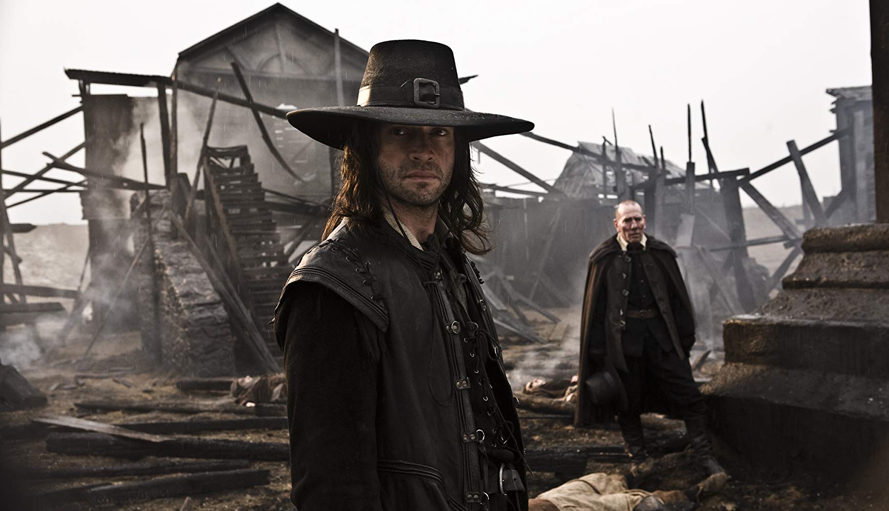 James Purefoy as Robert E. Howard's Puritan warrior Solomon Kane with Pete Postlethwaite in the background in Solomon Kane (2009)