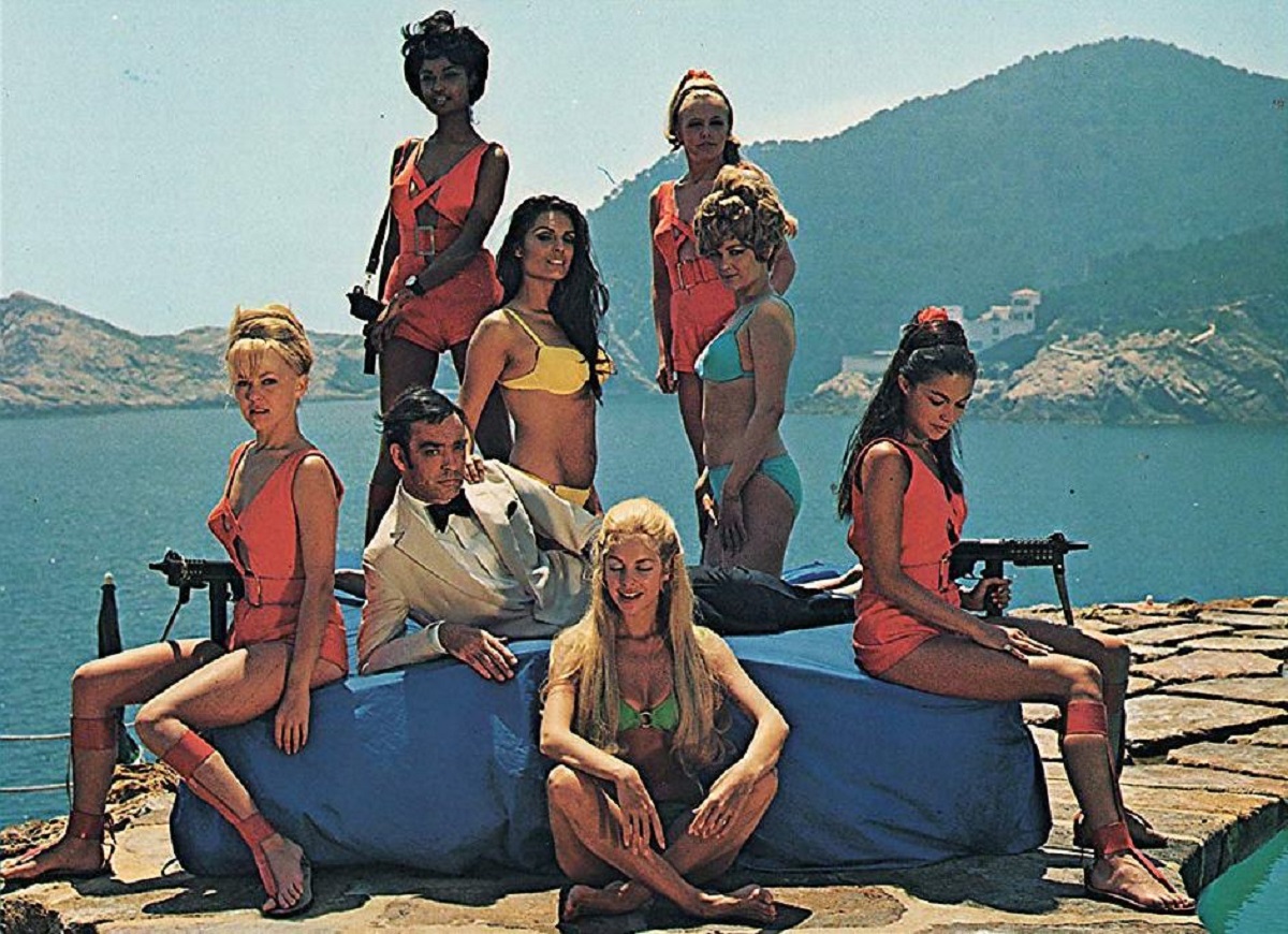 Hugh Drummond (Richard Johnson) relaxes amid a group of the women with robot brains in Some Girls Do (1969)