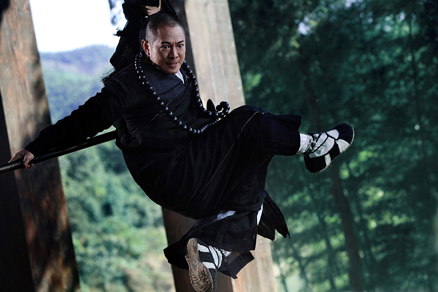 Jet Li as Abbot Fahai on a mission to hunt demons in The Sorcerer and the White Snake (2011)