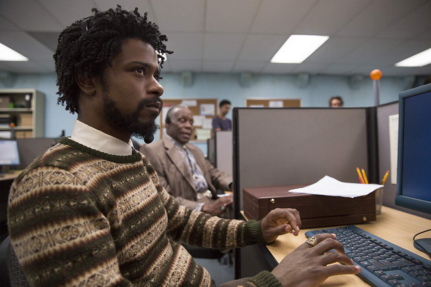 Cassius Green (Lakeith Stanfield) takes a job telemarketing in Sorry to Bother You (2018)