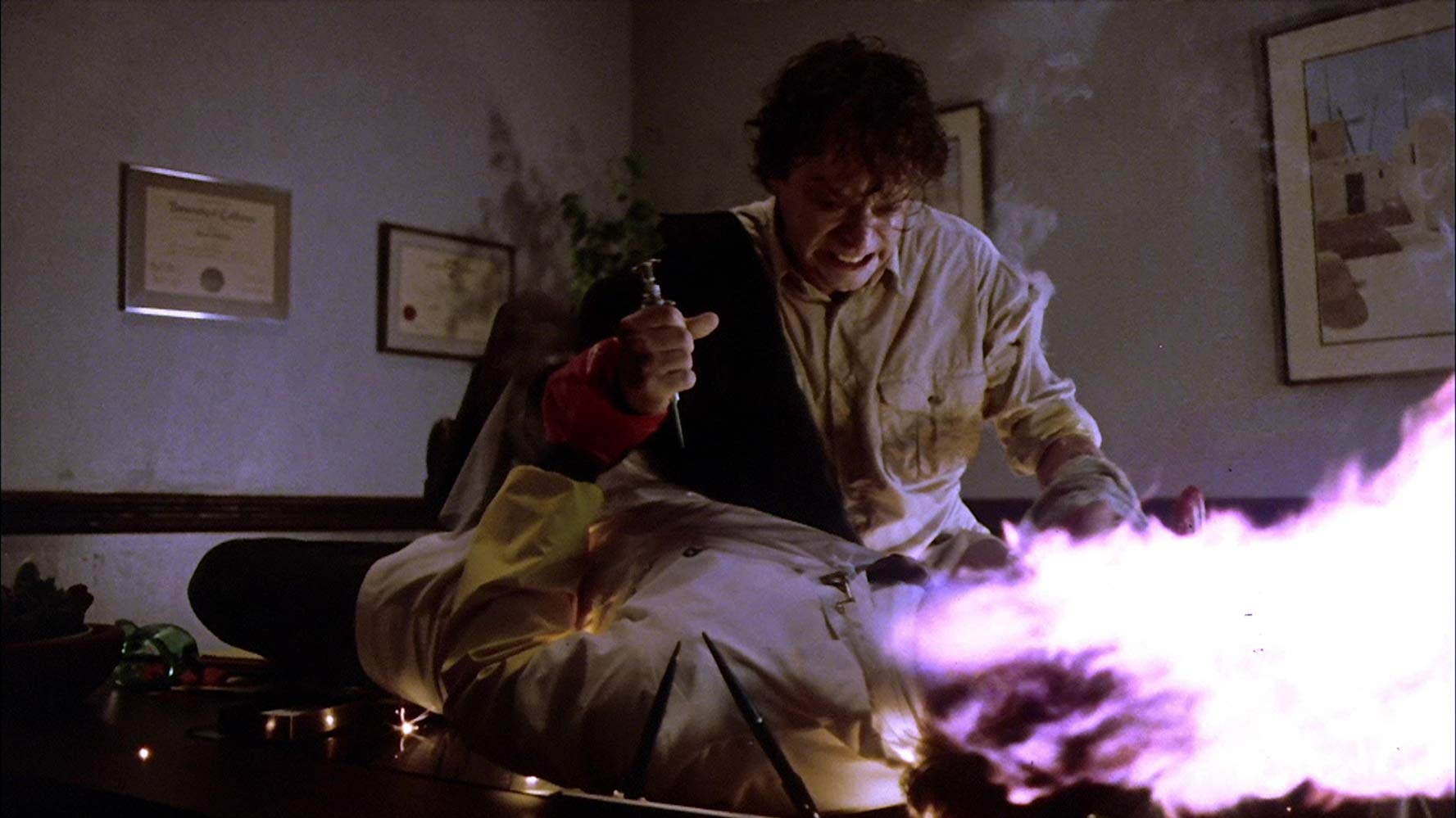 Pyrokinetic Brad Dourif causes a victim's head to explode in Spontaneous Combustion (1990)