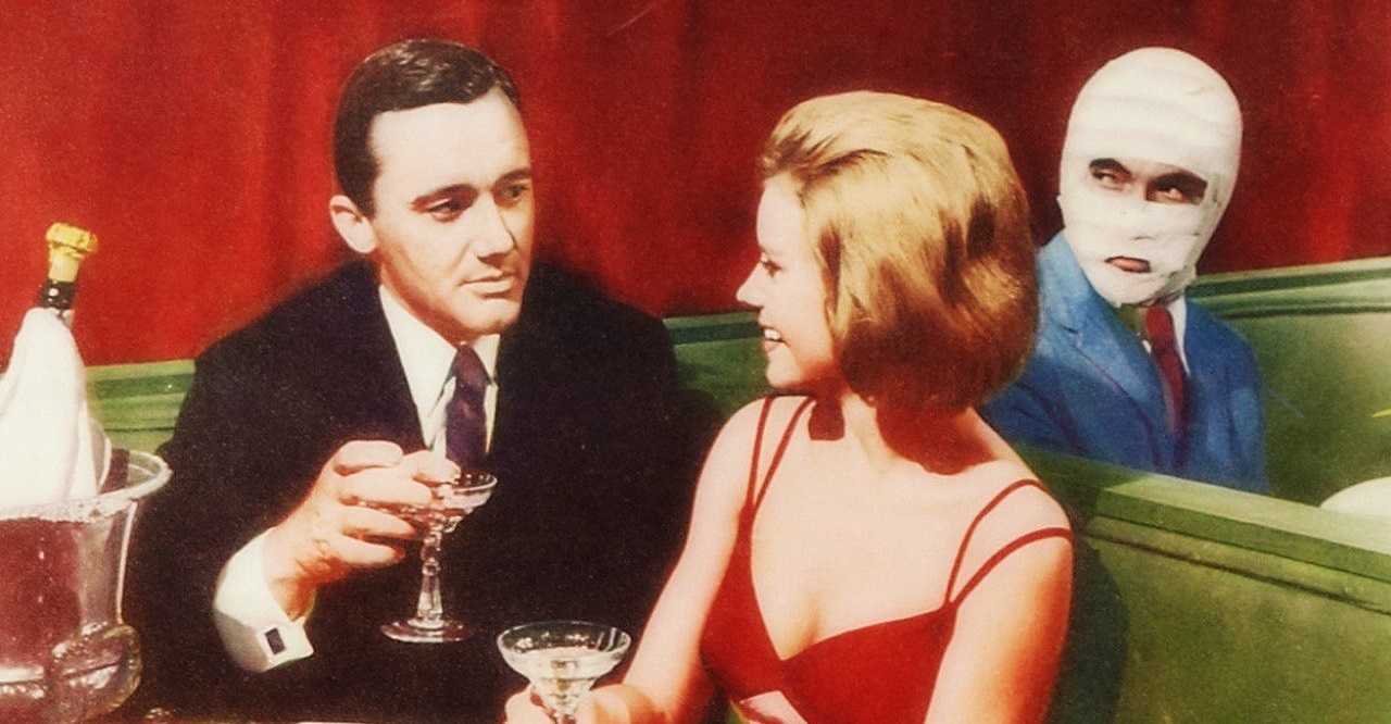 Napoleon Solo (Robert Vaughn) with girlfriend Sharon Farrell as the surgical double looks on in The Spy With My Face (1965)