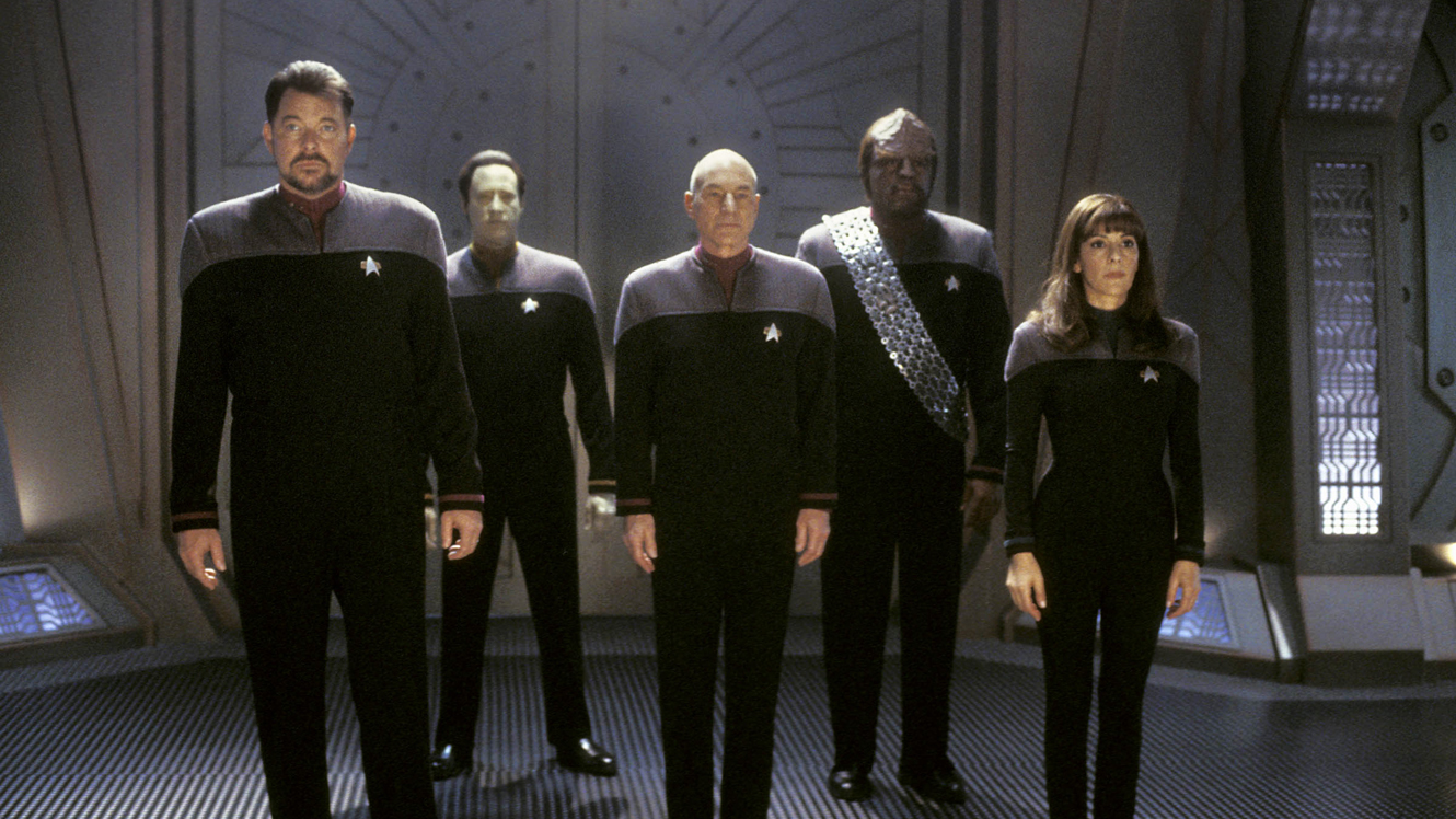 The Enterprise crew beam into action - Commander Riker (Jonathan Frakes), Data (Brent Spiner), Captain Picard (Patrick Stewart), Worf (Michael Dorn) and Counselor Troi (Marina Sirtis) © Paramount Pictures in Star Trek: Nemesis (2002)