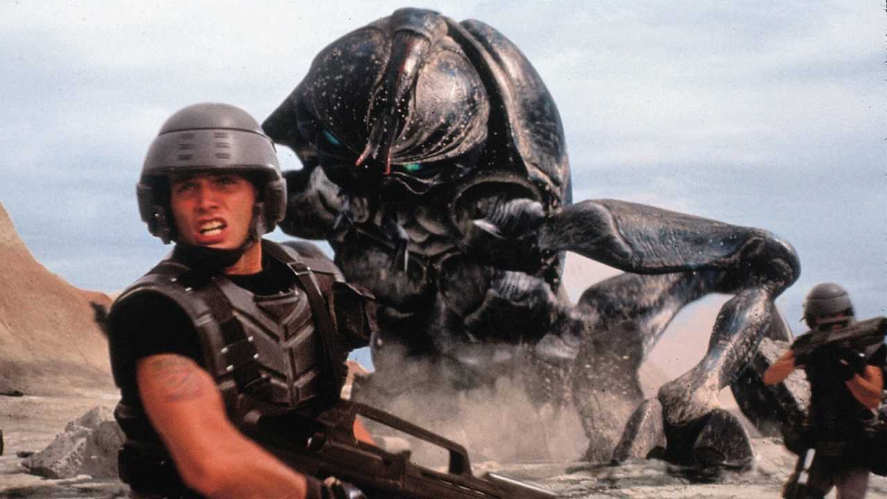 Johnny Rico (Casper Van Dien) flees from one of the alien bugs in Starship Troopers (1997)