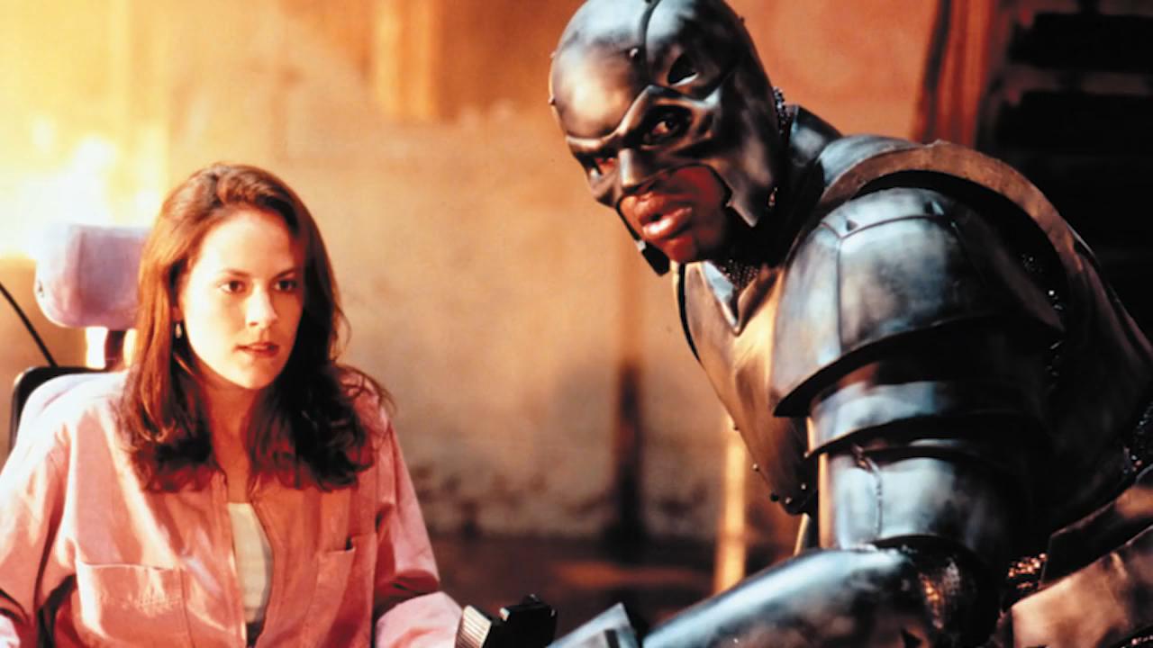 Sparky Sparks (Annabeth Gish) and Steel (Shaquille O’Neal) in Steel (1997)