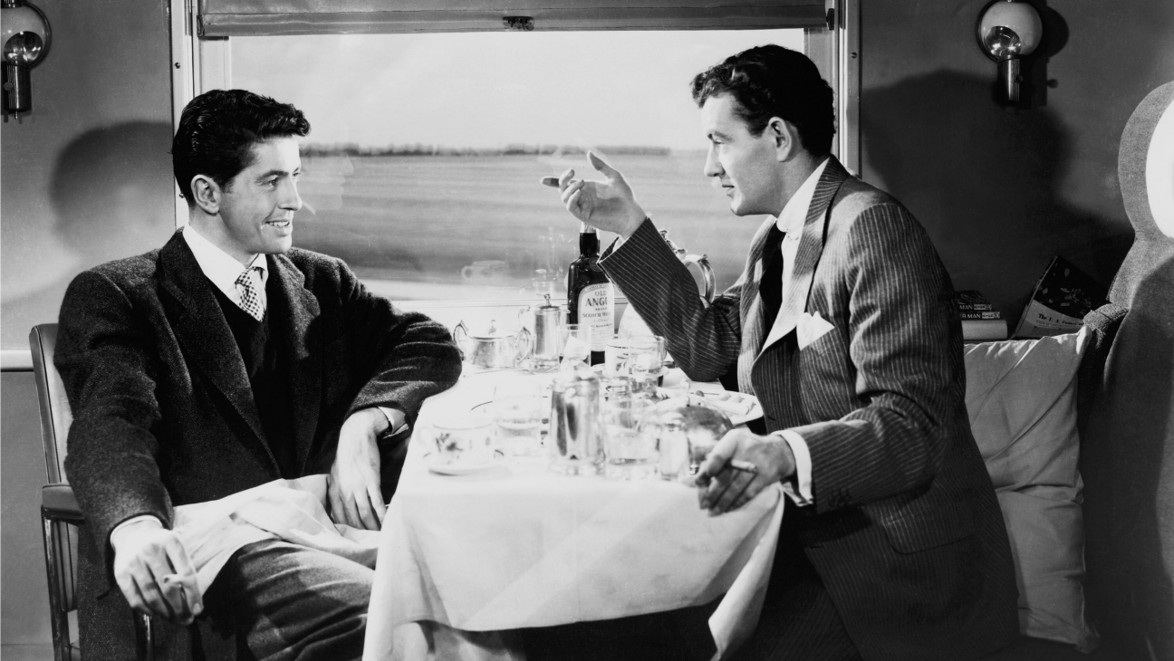 Strangers Farley Granger and Robert Walker make a murder pact after meeting in a train carriage in Strangers on a Train (1951)