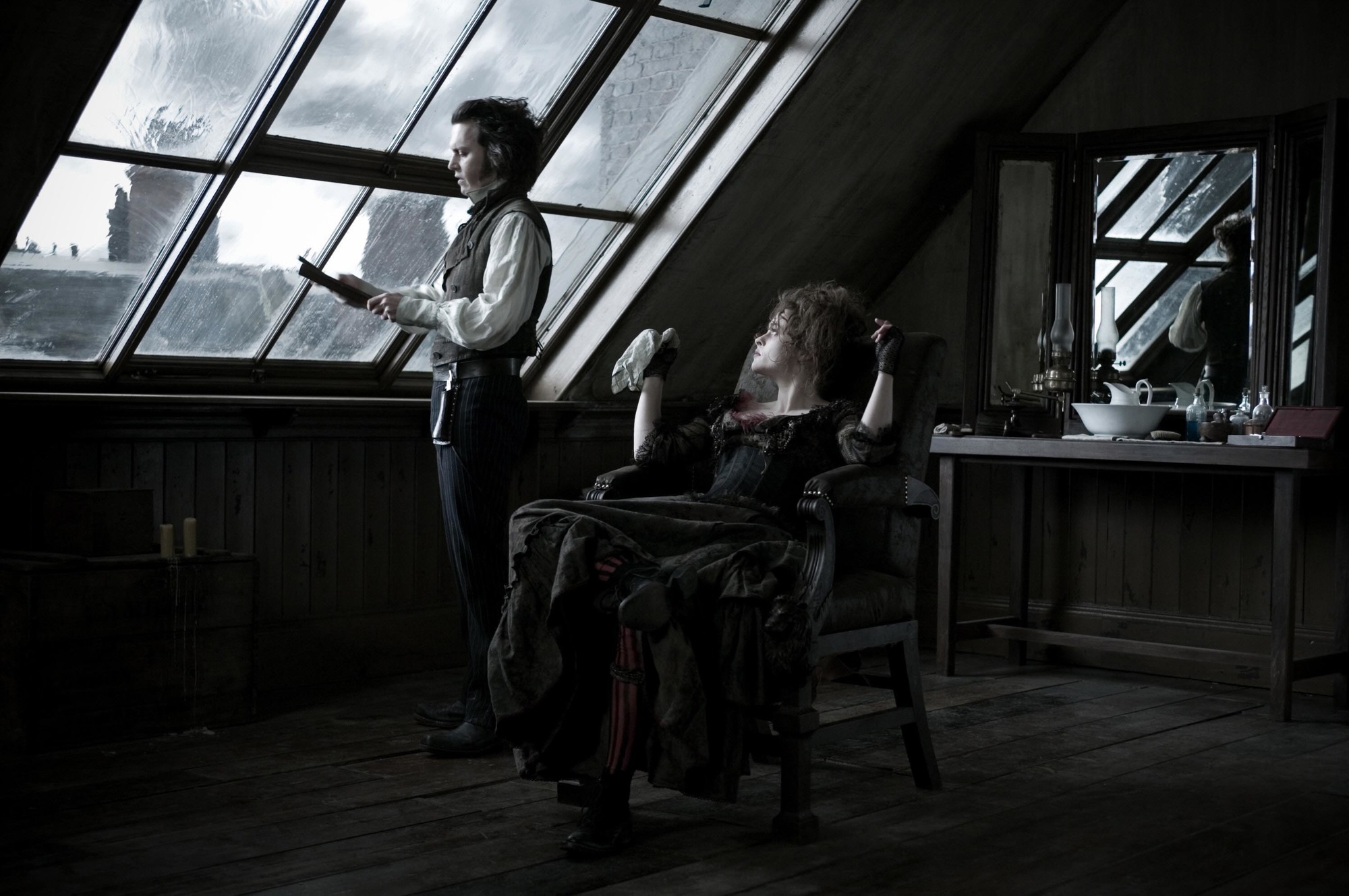 Sweeney Todd (Johnny Depp) and Mrs Lovett (Helena Bonham Carter) in Sweeney's barber shop in Sweeney Todd: The Demon Barber of Fleet Street (2007)