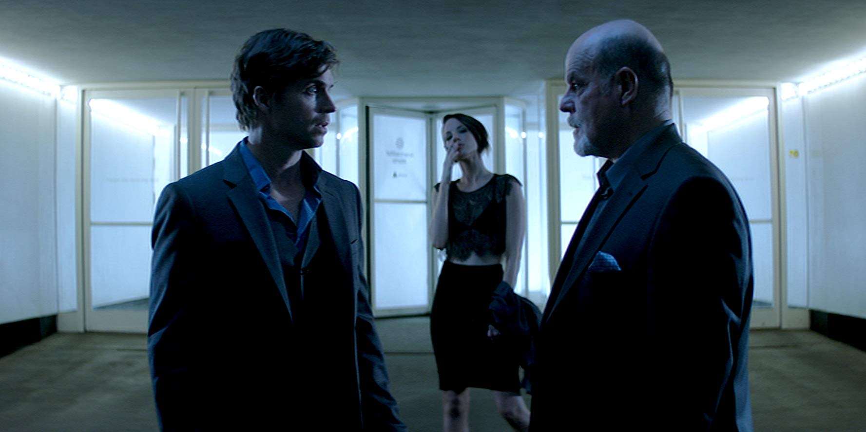 (l to r) Time traveller Chad McKnight, femme fatale Brianne Davis and venture capitalist bad guy Michael Ironside in Synchronicity (2015)