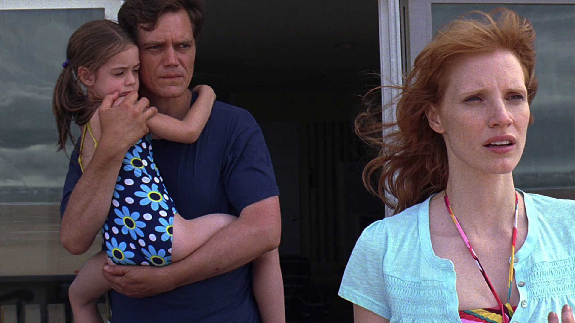 Michael Shannon holding daughter Tova Stewart with wife Jessica Chastain in Take Shelter (2011)