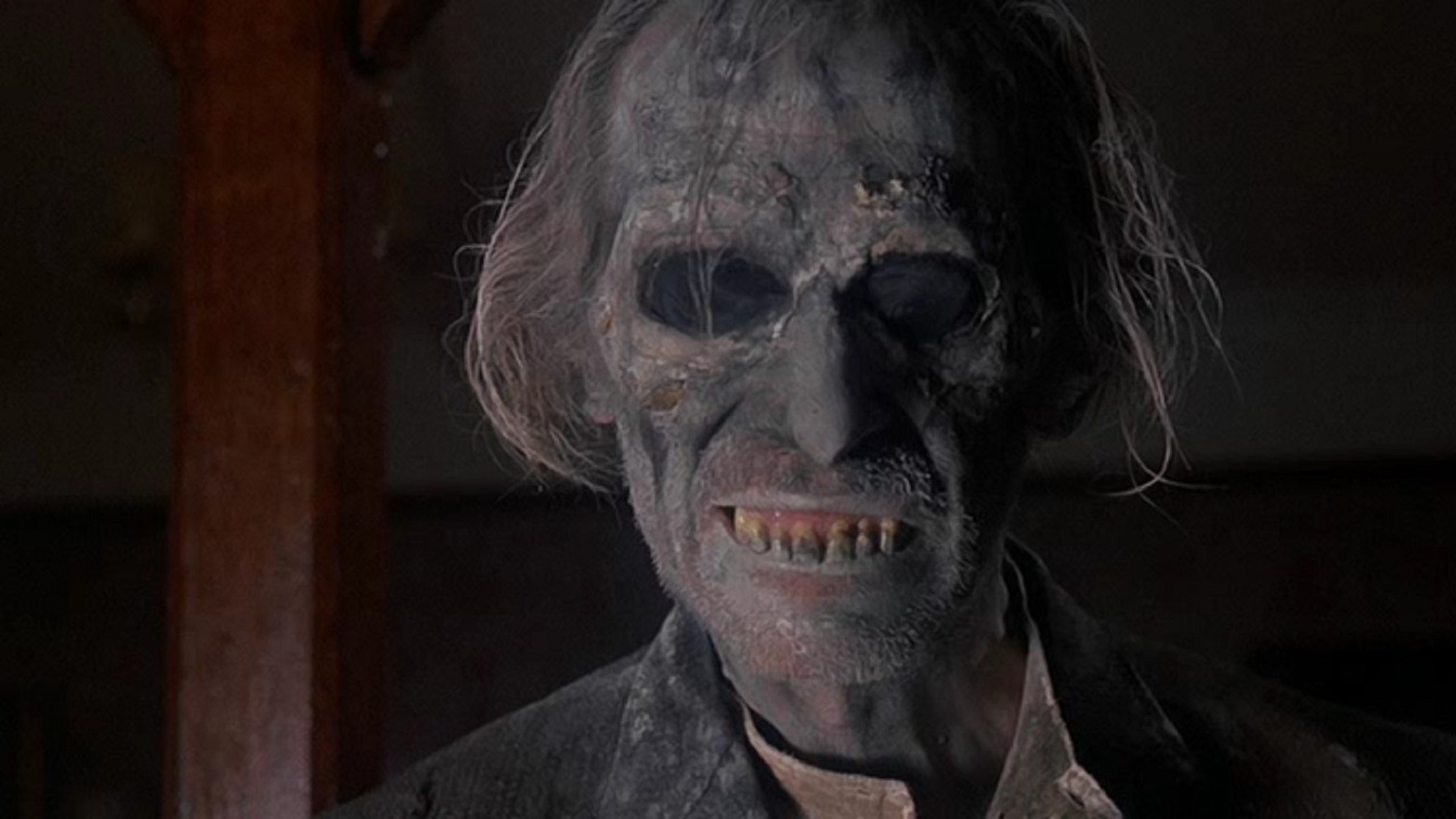 Grimsdyke (Peter Cushing) returns from the grave in the Poetic Justice episode of Tales from the Crypt (1972)