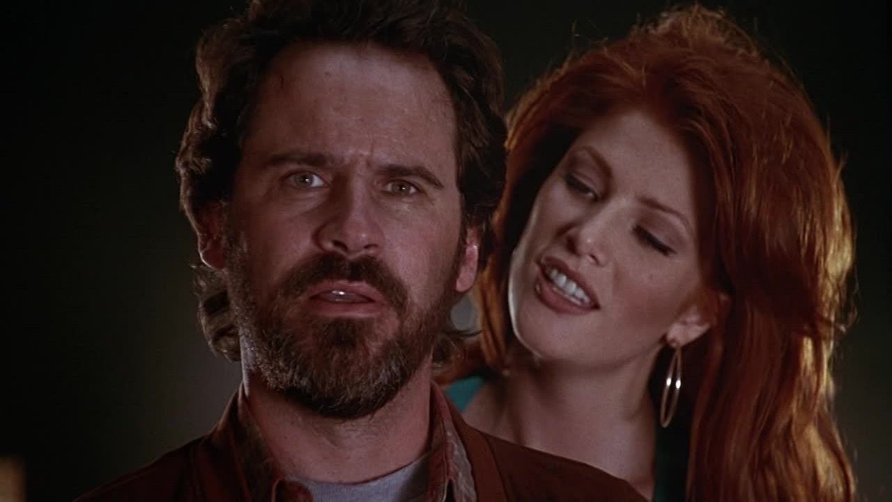 Private eye Dennis Miller and Angie Everhart as the vampire Lilith in Tales from the Crypt Presents Bordello of Blood (1996)