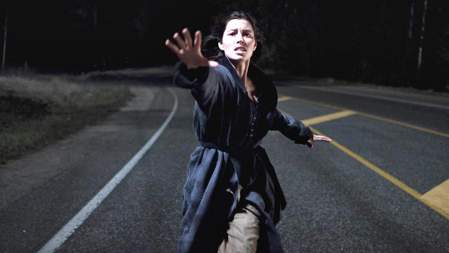 Jessica Biel runs in pursuit as The Tall Man's truck abducts her child in The Tall Man (2012)