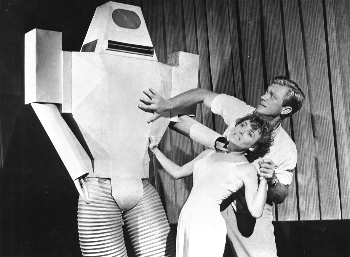 Kathleen Crowley and Richard Denning face the robot in Target Earth (1954)