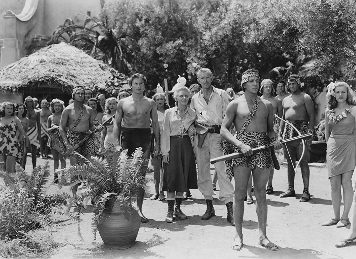 Lex Barker, Evelyn Ankers and Alan Napier enter a native village in Tarzan's Magic Fountain (1949)