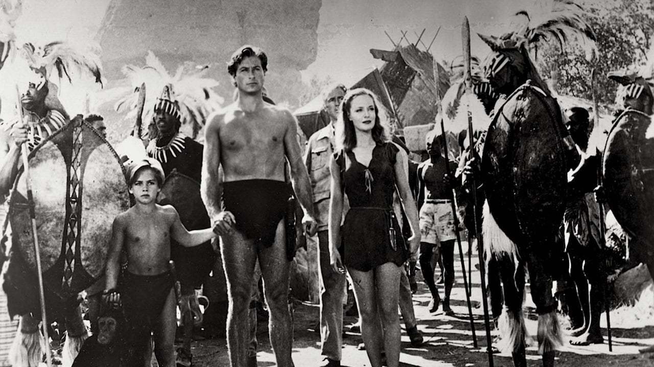 (l to r) The orphan Joey Martin (Tommy Carlton), Tarzan (Lex Barker) and Jane (Dorothy Hart) enter native territory in Tarzan's Savage Fury (1952)