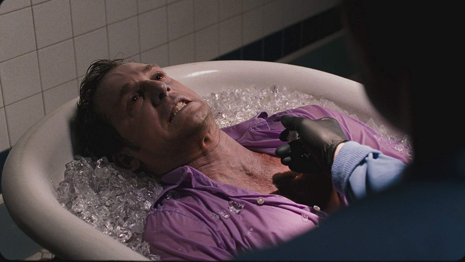 Josh Lucas being operated on in a bath of ice in Tell-Tale (2009)