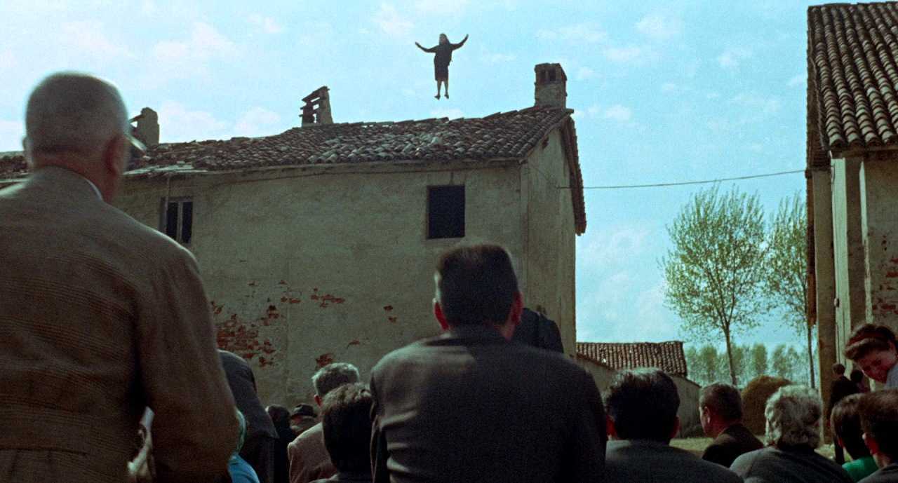 Maid Laura Betti is levitated into he air in an apparent miracle in Teorema (1968)