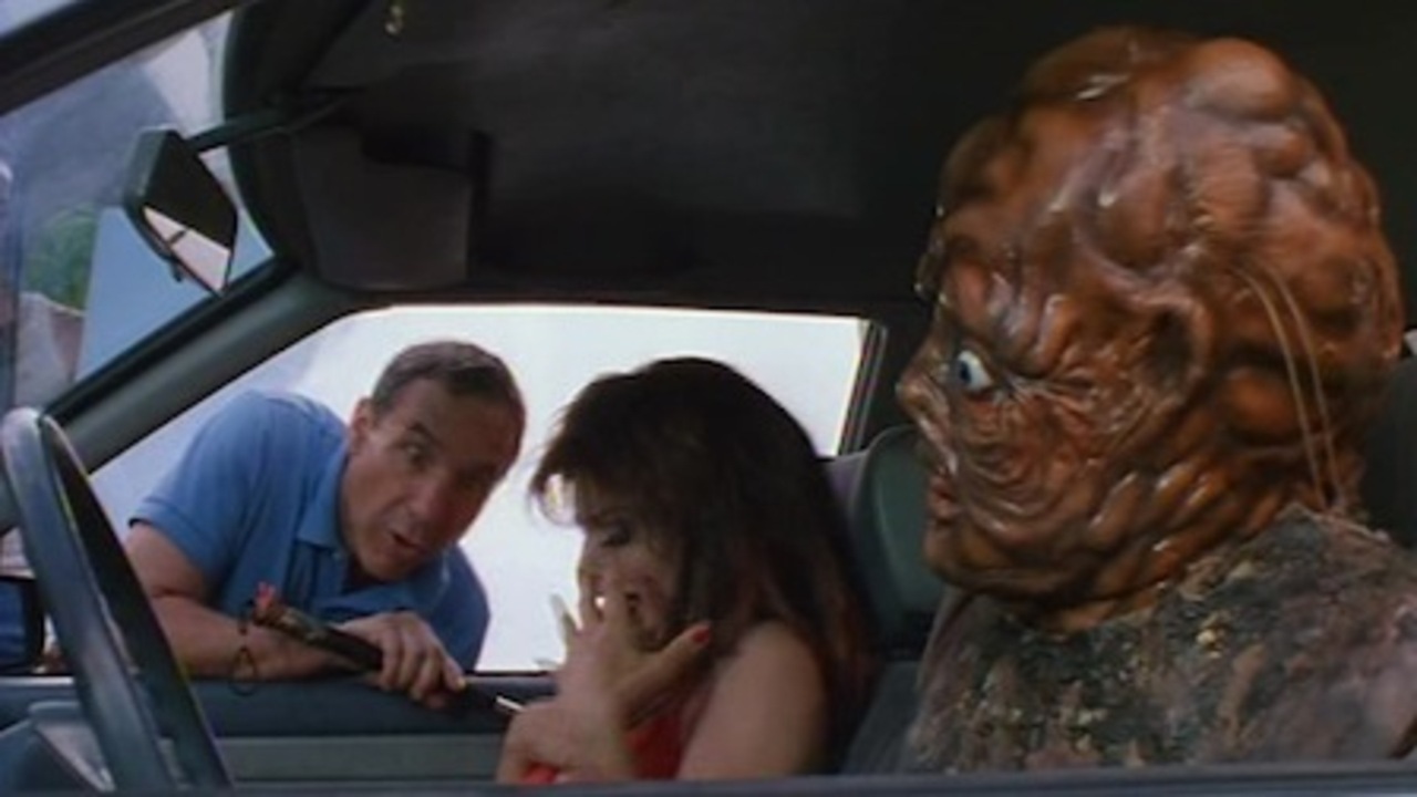 (l to r) Larry Benjamin (Lloyd Kaufman on whose autobiography the film is based) directs Debbie Rochon and the Toxic Avenger in Terror Firmer (1999)