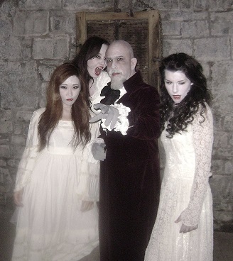 Director/writer Anthony D.P. Mann as Count Dracula (c) surrounded by vampire brides (Angela Faulkner, Vikki Jin and Noelle Piche) in Terror of Dracula (2012)