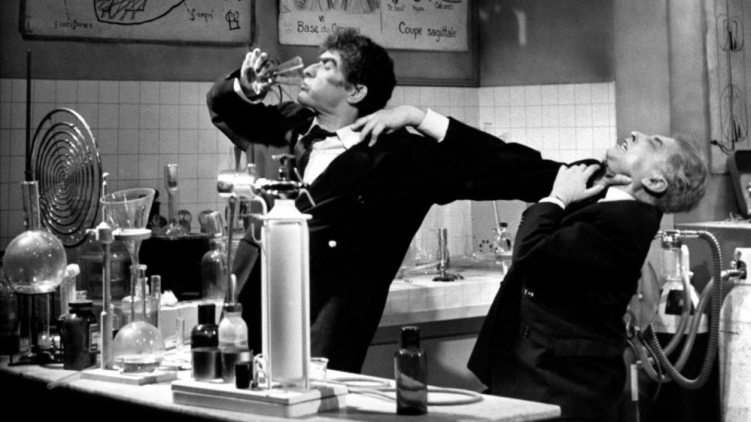 Jean-Louis Barrault as Mr Ophale holds off Teddy Bilis as he drinks the potion in The Testament of Dr Cordelier (1959)