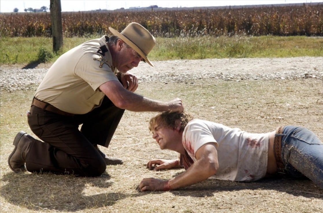 Sheriff Hoyt (R.Lee Ermey) brutalises Matt Bomer in The Texas Chainsaw Massacre: The Beginning (2006)