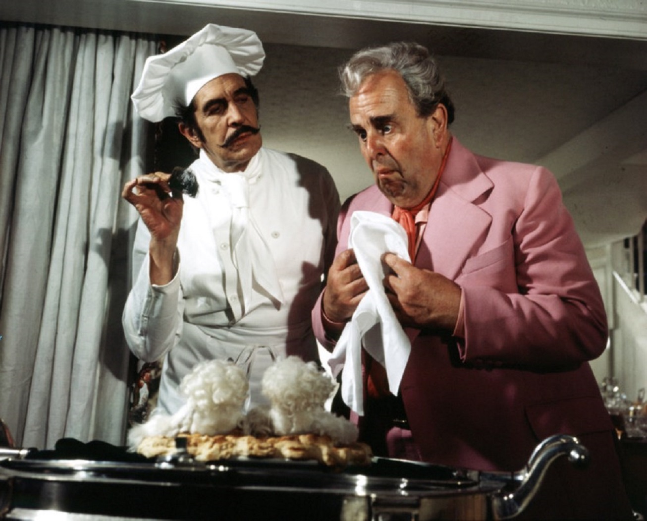 Mad Shakespearean actor Richard Lionheart (Vincent Price) serves Robert Morley his two beloved poodles baked in a pie in Theater of Blood (1973)