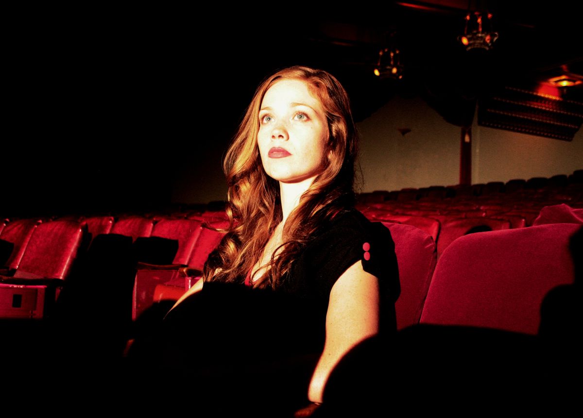 Virginia Newcomb sitting down to watch the show in the Theatre Guignol in The Theatre Bizarre (2011)