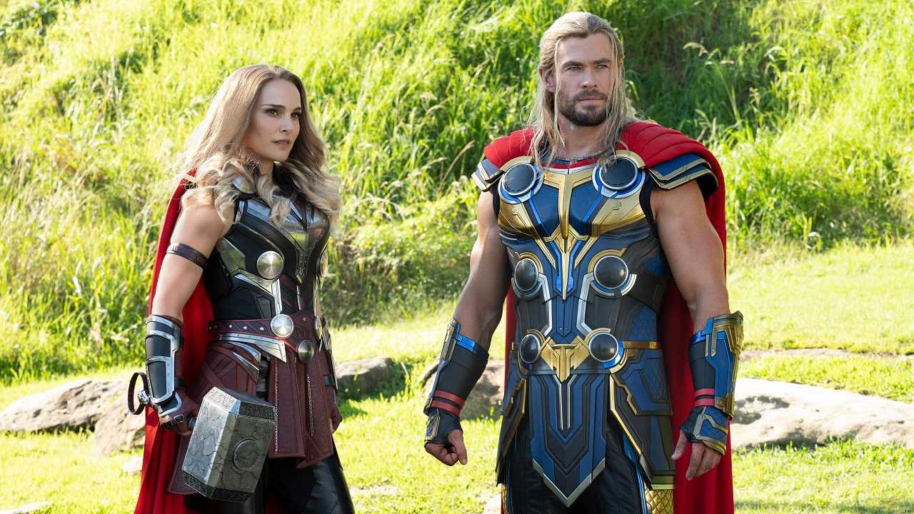 Jane Foster (Natalie Portman) as The Mighty Thor and Thor (Chris Hemsworth) in Thor Love and Thunder (2022)