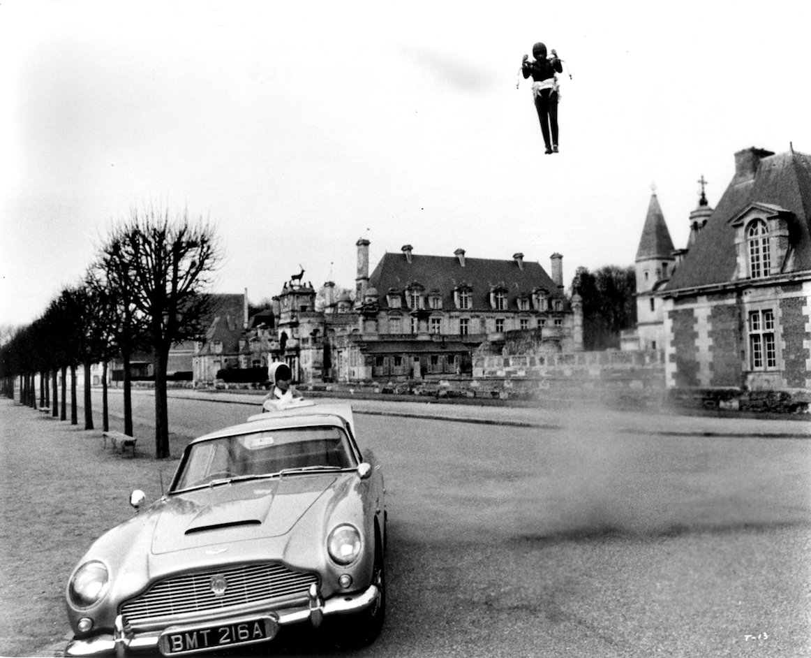 James Bond escapes from the chateau by rocket jetpck to the waiting Aston Martin in Thunderball (1965)