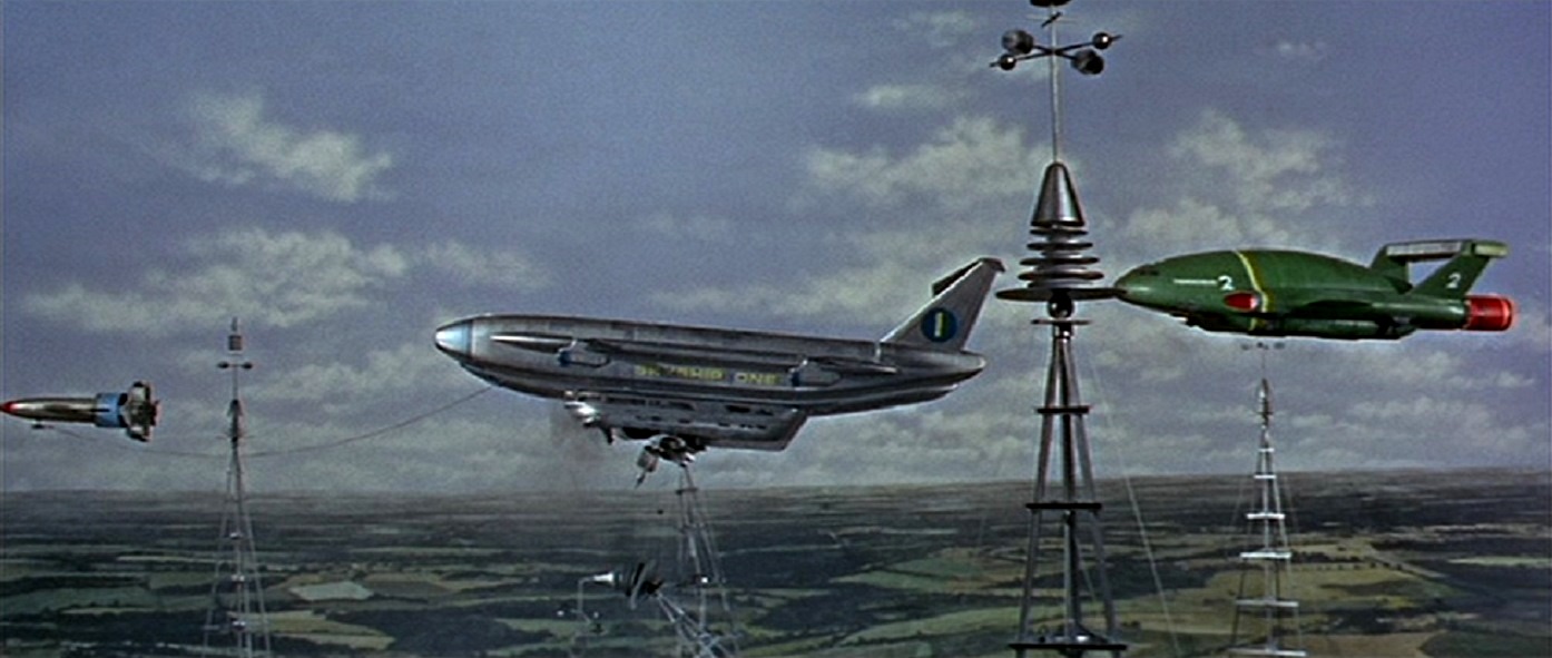 Rescue attempt of Skyship 1 impaled on a tower flanked by Thunderbird 1 and Thunderbird 2 in Thunderbird 6 (1968)