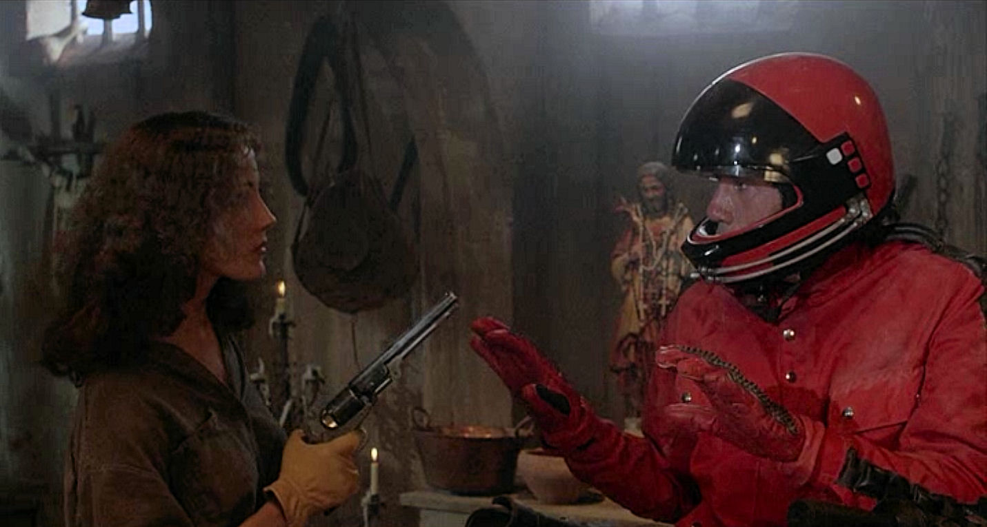 Belinda Bauer holds temporally displaced motorcyclist Fred Ward at gunpoint in Timerider The Legend of Lyle Swann (1982)