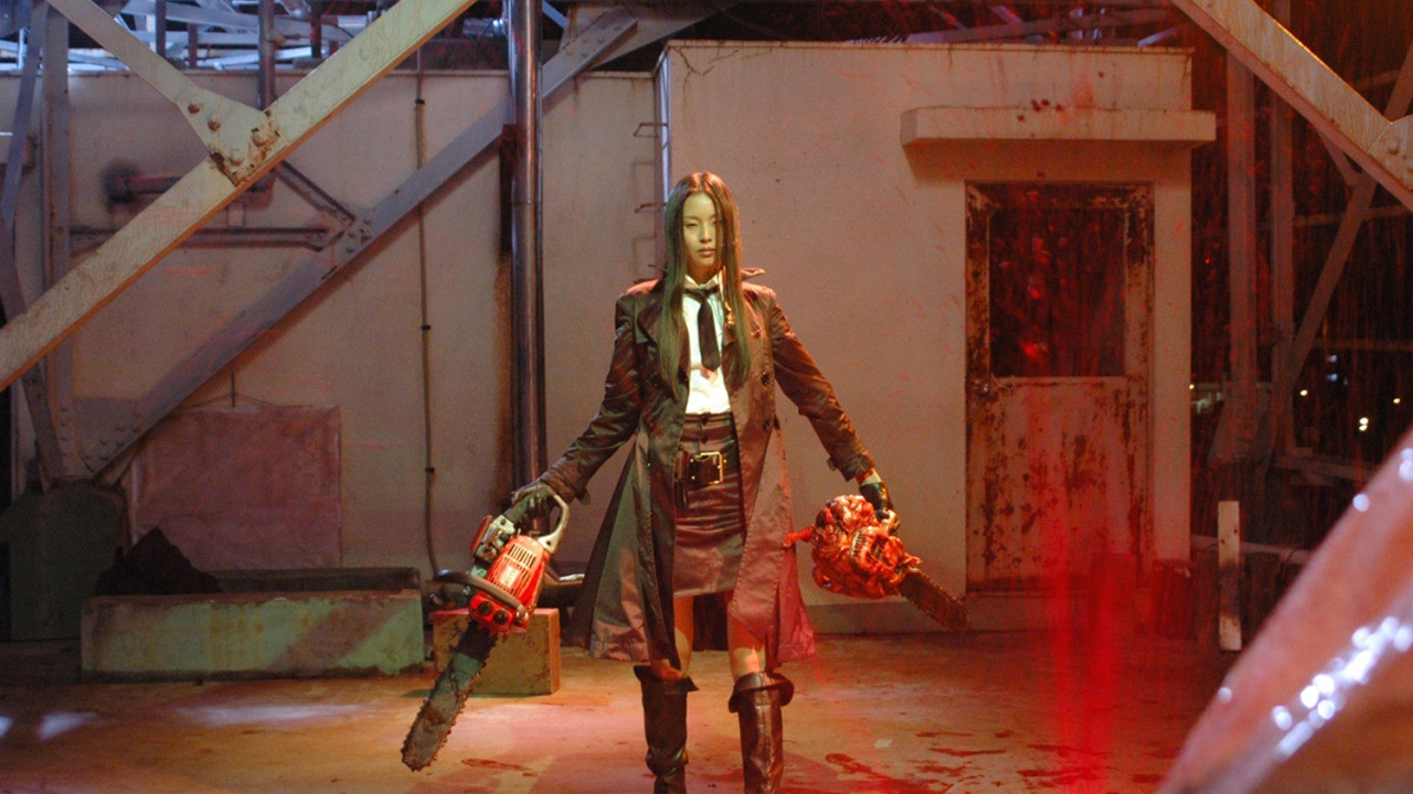 Eihi Shiina heads into action with chainsaws at the ready in Tokyo Gore Police (2008)