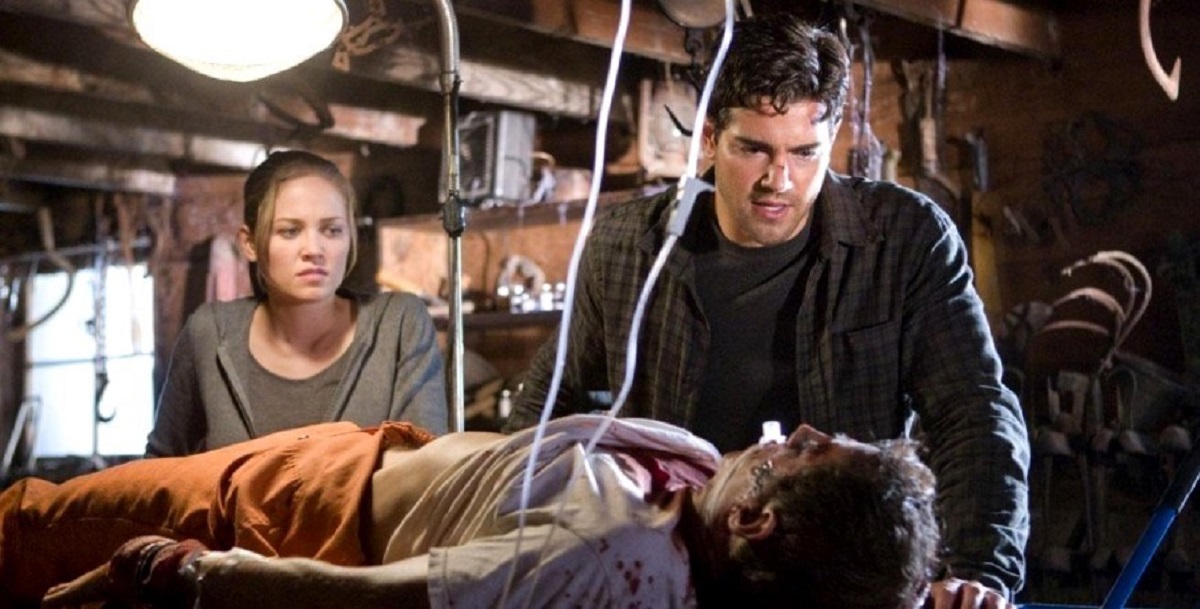 Erika Christensen and Jesse Metcalfe with an imprisoned Bill Lippincott in The Tortured (2010)