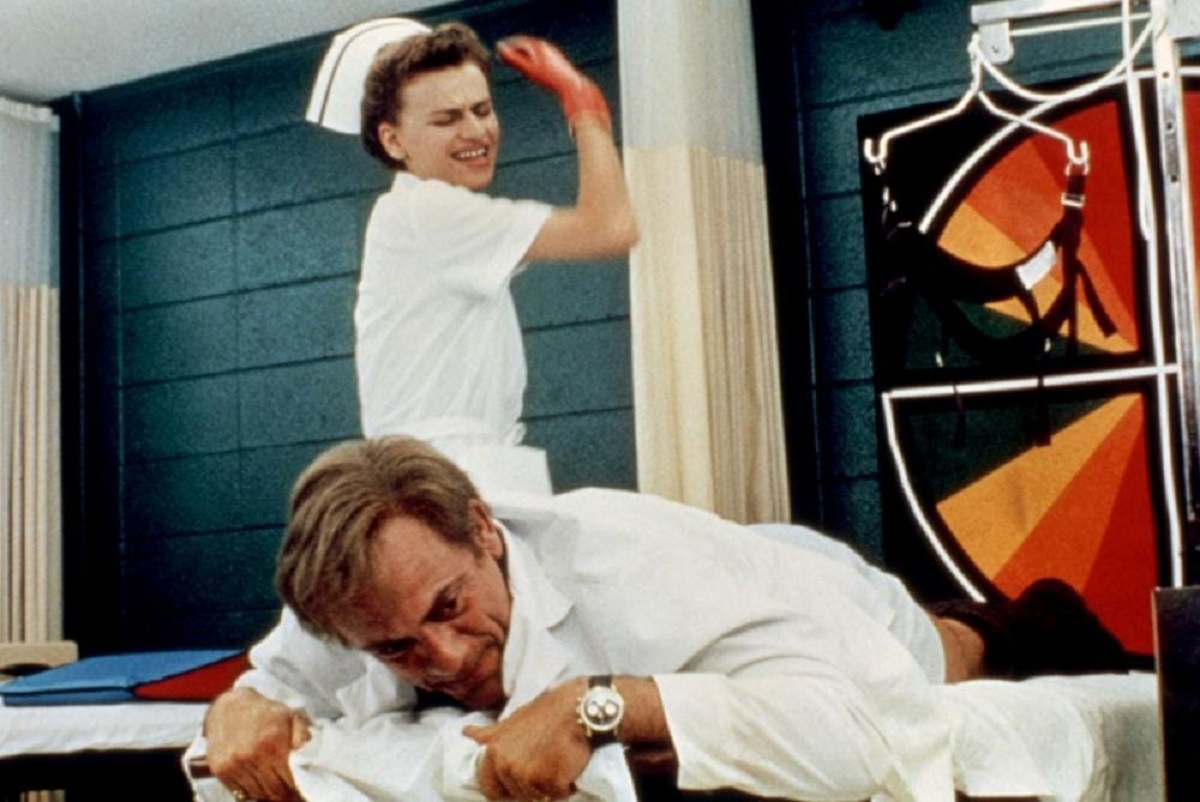 Christopher Lloyd receives a spanking from his nurse Sandra Bernhard in Track 29 (1988)