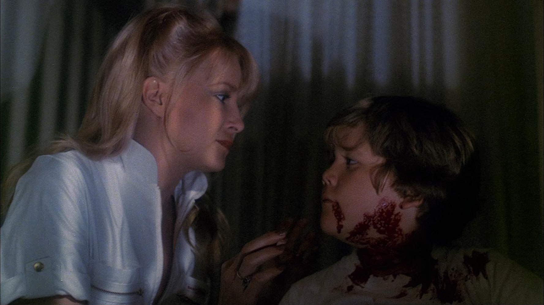 Babysitter Jackelyn Giroux and Chris Graver in Trick or Treats (1982)