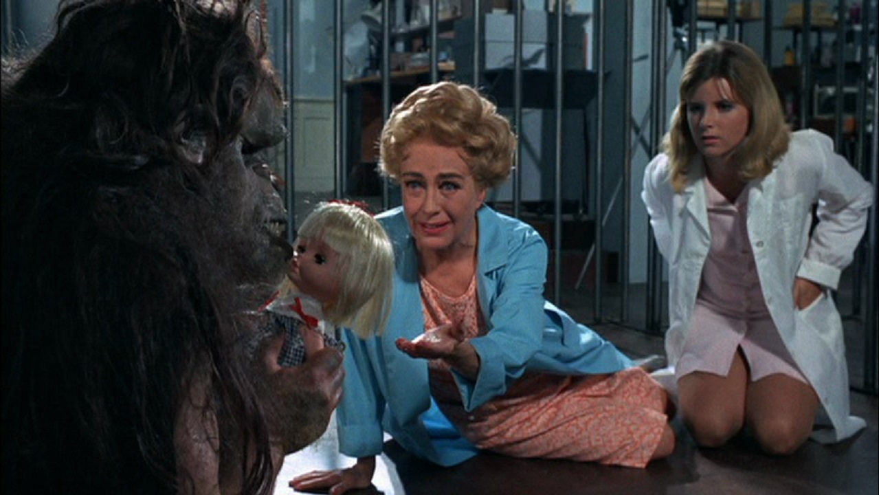 Joan Crawford and daughter Kim Braden play with the Trog (Joe Cornelius) in Trog (1970)