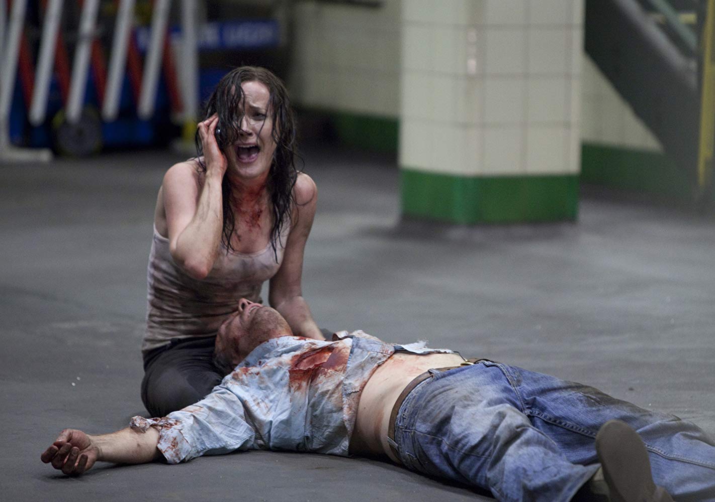 TV reporter Natasha Warner (Bel Delia) with cameraman Steve Davis (lying on ground) in The Tunnel (2011)