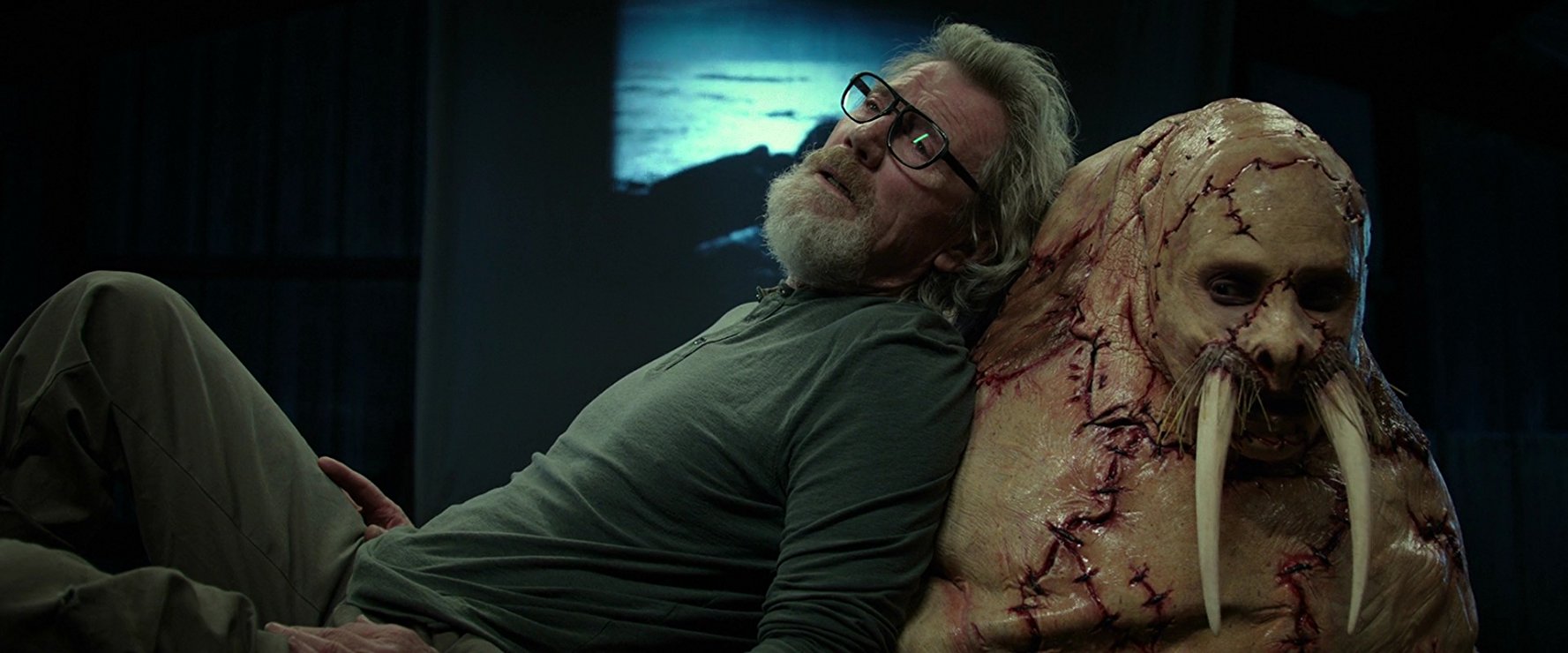 Michael Parks and Justin Long after being surgically transformed into a walrus in Tusk (2014)