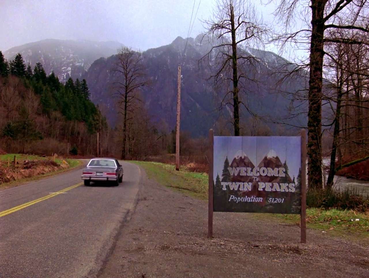 The opening credits of the tv series accompanied by Angela Badalamenti's haunting bass-line in Twin Peaks (1990)