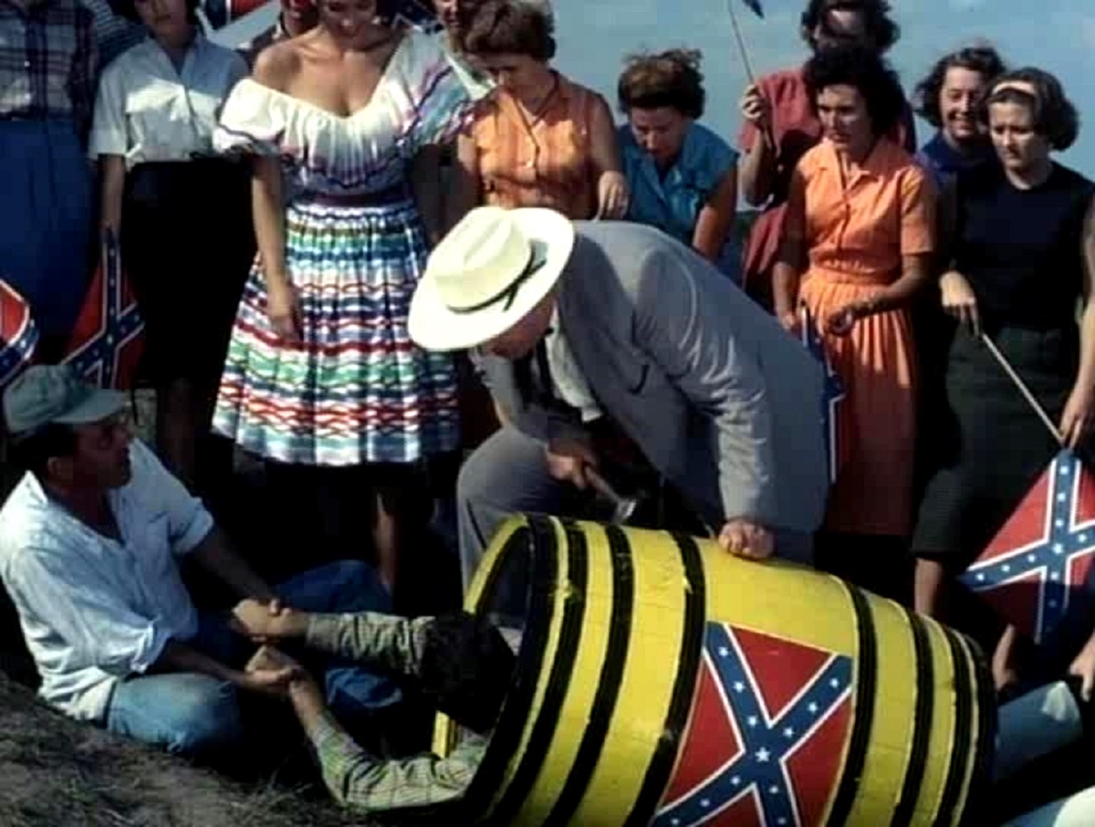 The townspeople prepare to roll a victim down a hill in a barrel of nails in Two Thousand Maniacs! (1964)